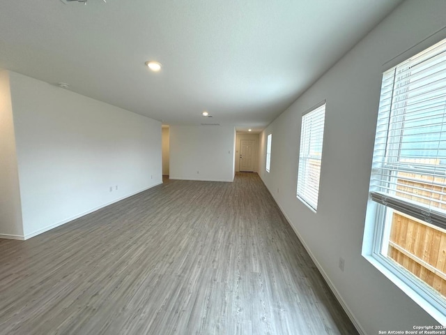 spare room with hardwood / wood-style flooring