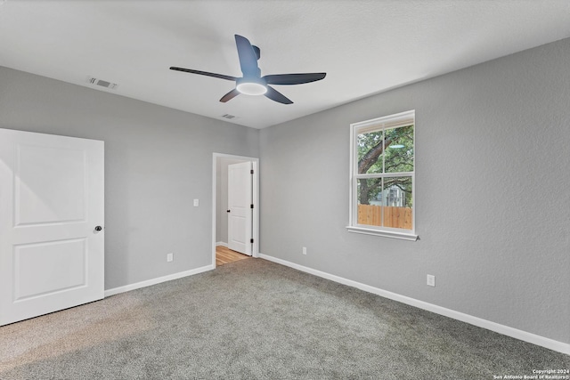 unfurnished bedroom featuring ceiling fan and carpet flooring