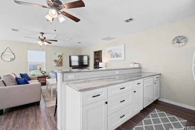 kitchen featuring ceiling fan, kitchen peninsula, dark hardwood / wood-style flooring, and white cabinets