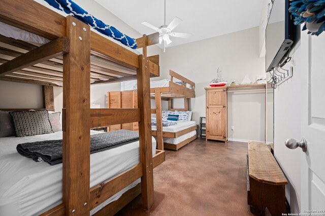 bedroom featuring ceiling fan and vaulted ceiling