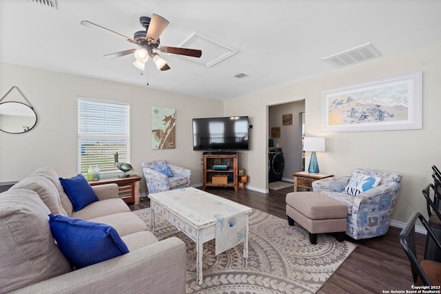 living room with washer / dryer, wood-type flooring, and ceiling fan