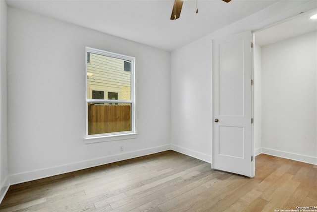 unfurnished room featuring ceiling fan and light hardwood / wood-style floors