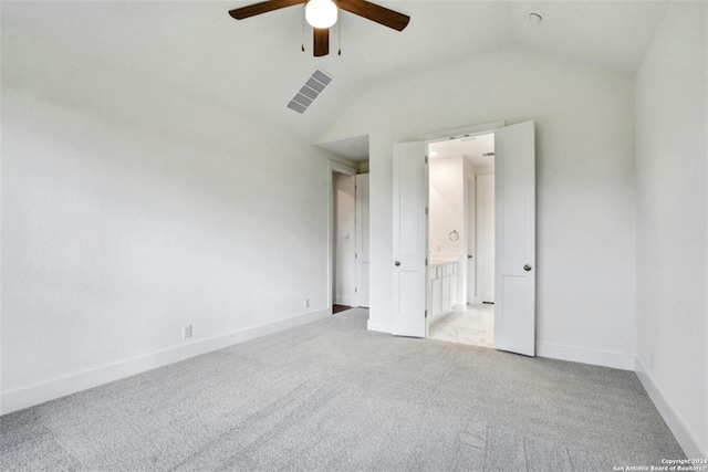 unfurnished bedroom with lofted ceiling, light colored carpet, and ceiling fan