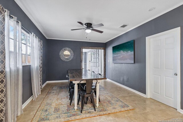 tiled dining area with crown molding and ceiling fan