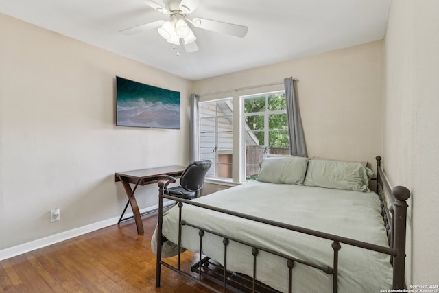 bedroom featuring dark hardwood / wood-style floors and ceiling fan