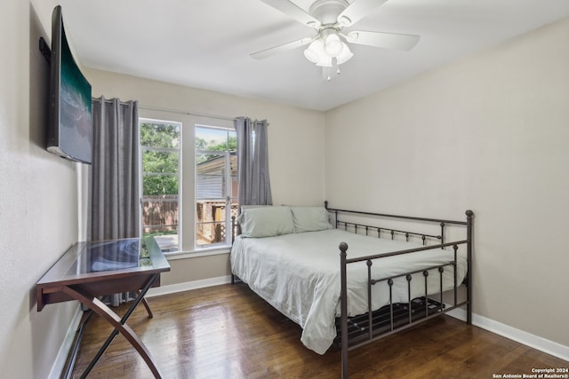 bedroom featuring dark wood-type flooring and ceiling fan