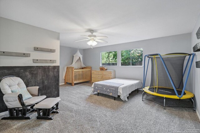 carpeted bedroom with ceiling fan