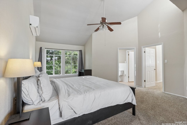 carpeted bedroom featuring a wall mounted AC, high vaulted ceiling, ensuite bath, and ceiling fan