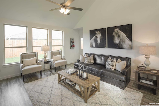 living room with high vaulted ceiling, ceiling fan, and hardwood / wood-style floors