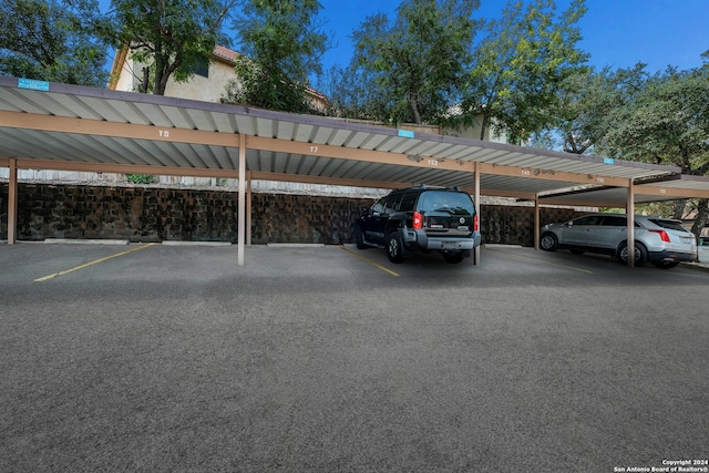 view of parking / parking lot with a carport