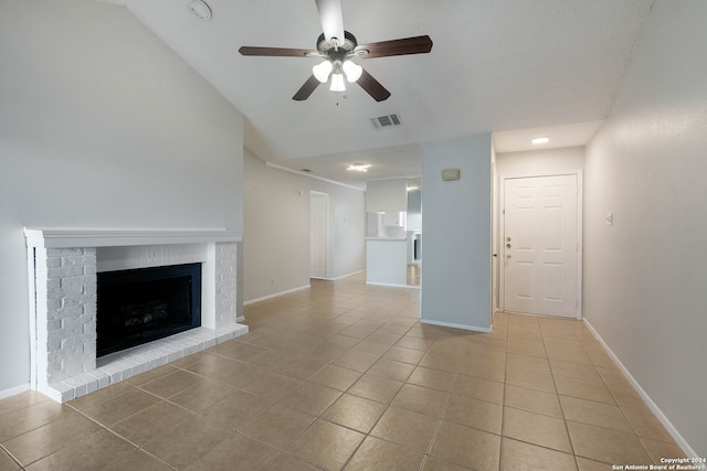 unfurnished living room featuring light tile patterned flooring, a fireplace, and ceiling fan