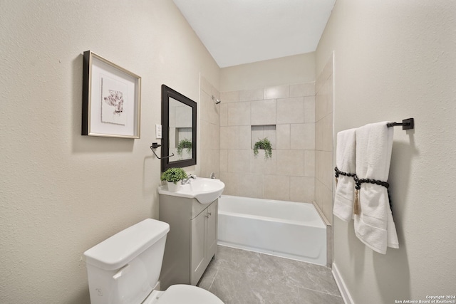 full bathroom featuring tile patterned flooring, vanity, toilet, and tiled shower / bath