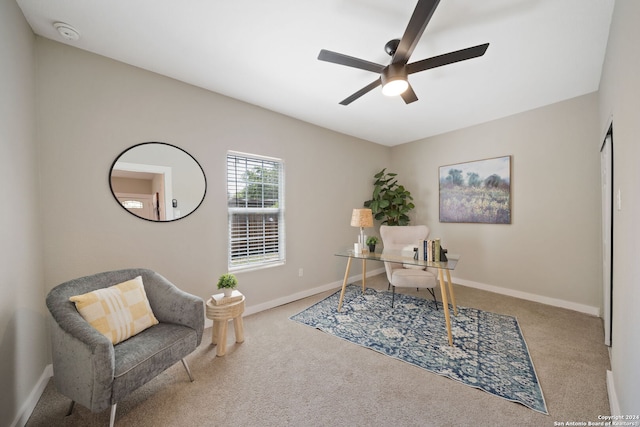 home office featuring ceiling fan and light carpet