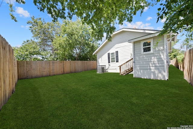 view of yard featuring central air condition unit