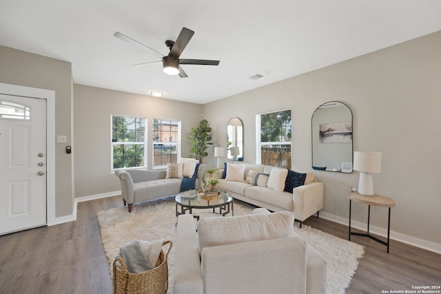 living room with hardwood / wood-style floors and ceiling fan