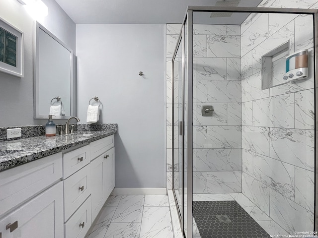 bathroom with tile patterned flooring, a shower with shower door, and vanity