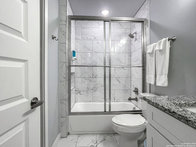 full bathroom featuring tile patterned flooring, combined bath / shower with glass door, toilet, and vanity