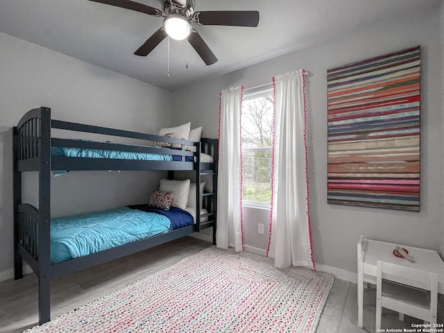 bedroom featuring ceiling fan and hardwood / wood-style floors