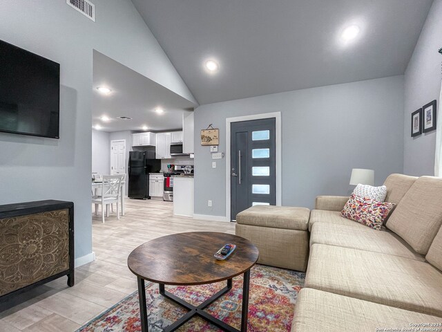 living room with lofted ceiling