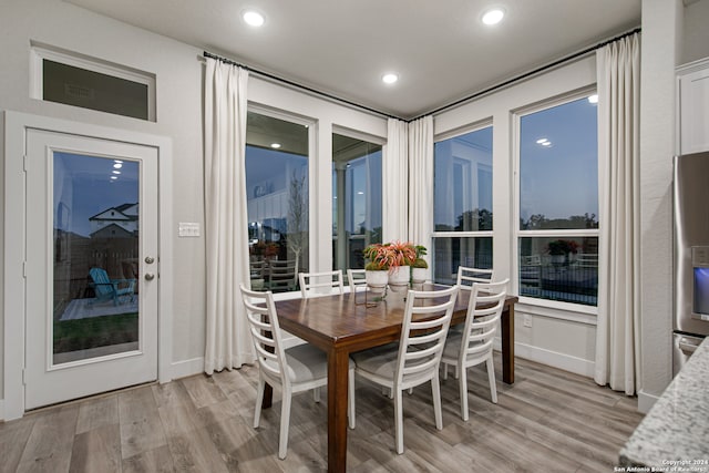 dining room with light wood-type flooring