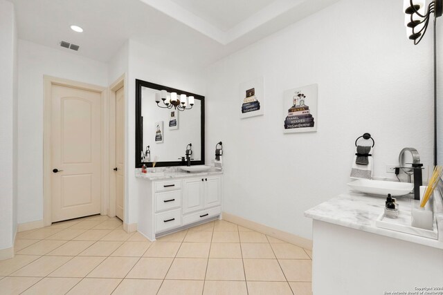 bathroom with tile patterned flooring and vanity