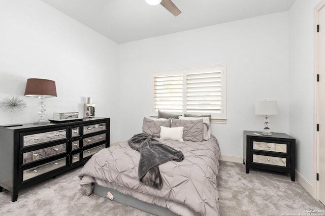 bedroom featuring ceiling fan and light colored carpet