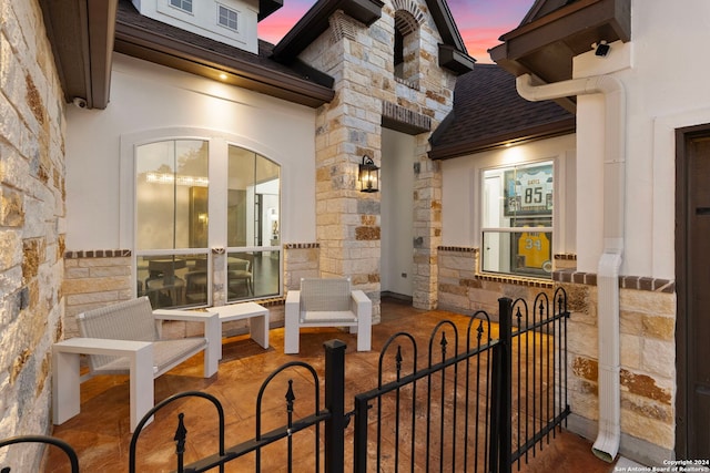 view of patio terrace at dusk