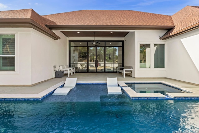 view of pool featuring a patio, ceiling fan, and an in ground hot tub