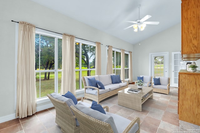 sunroom / solarium featuring a healthy amount of sunlight, vaulted ceiling, and ceiling fan