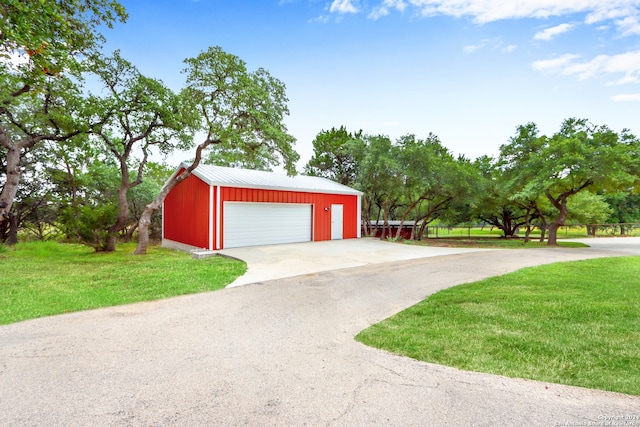 garage with a lawn