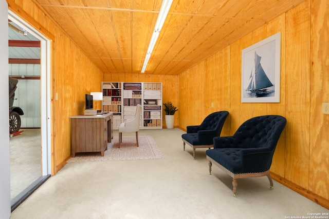 living area featuring wood walls and wooden ceiling