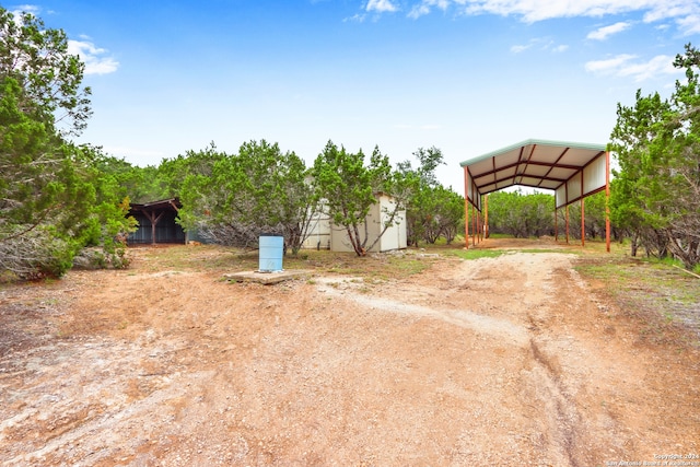 view of yard with a carport