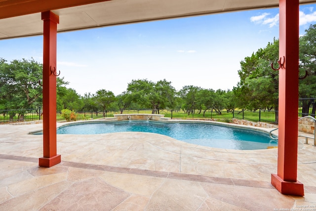 view of swimming pool featuring a patio and pool water feature