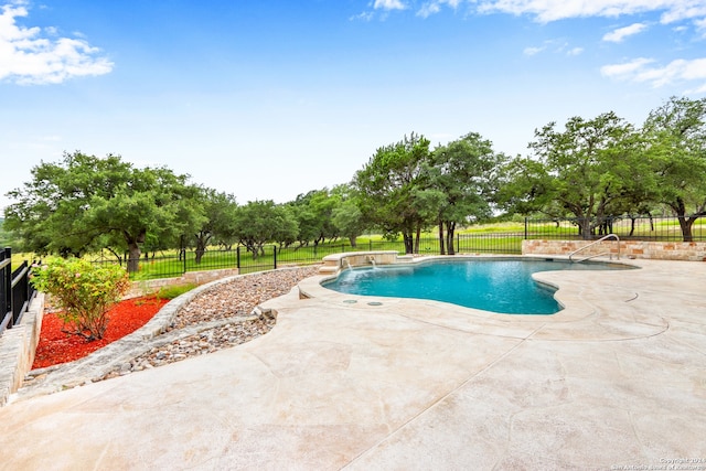 view of swimming pool featuring a patio area and pool water feature