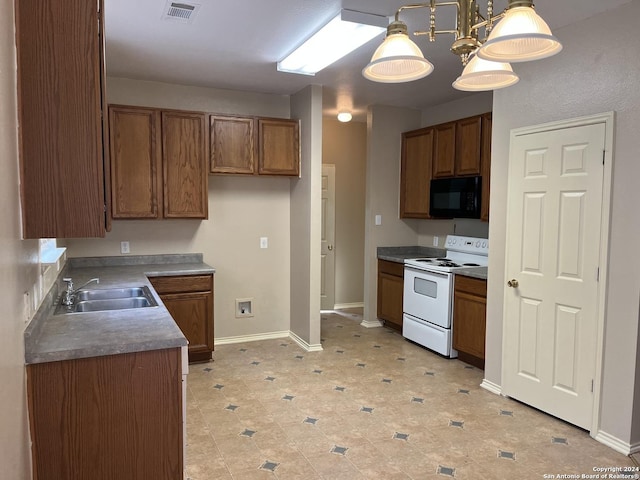 kitchen with black microwave, electric range, a sink, brown cabinets, and decorative light fixtures