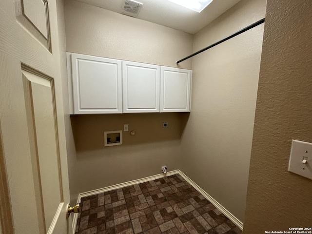 laundry room featuring hookup for a gas dryer, hookup for an electric dryer, visible vents, baseboards, and cabinet space