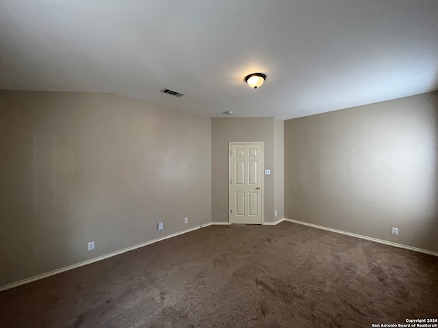 unfurnished room featuring carpet