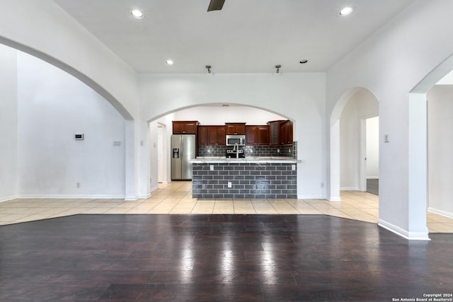 unfurnished living room with light tile patterned flooring