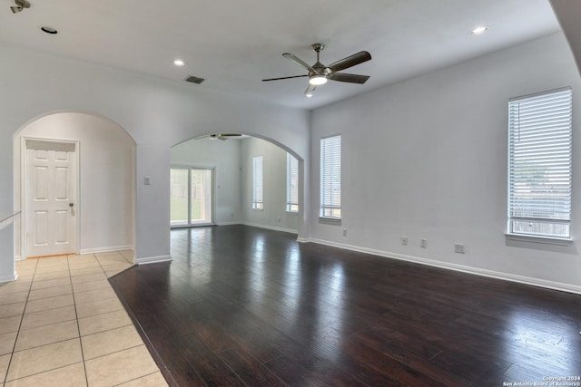 spare room featuring ceiling fan and light wood-type flooring