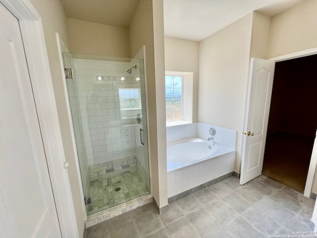 bathroom featuring separate shower and tub and tile patterned flooring