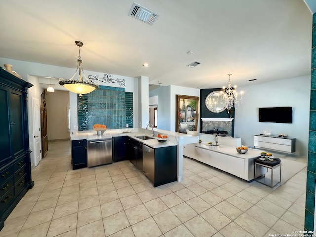 kitchen with open floor plan, light countertops, a sink, and visible vents