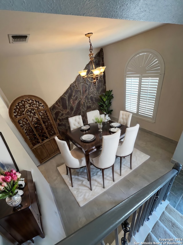 dining room featuring a notable chandelier