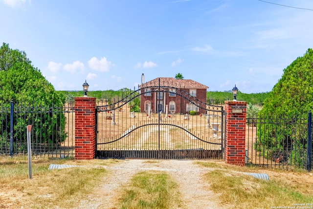 view of gate featuring fence