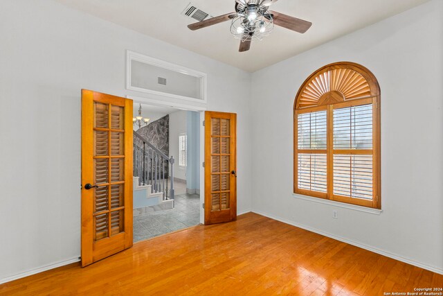 unfurnished bedroom with a closet, ceiling fan, and hardwood / wood-style floors