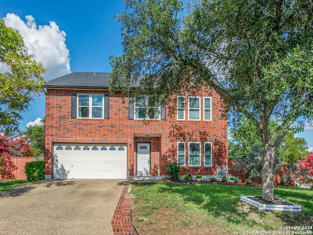 view of front facade featuring a front yard and a garage