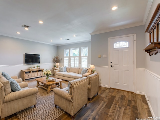 living room with dark wood-style flooring, a wainscoted wall, recessed lighting, visible vents, and ornamental molding