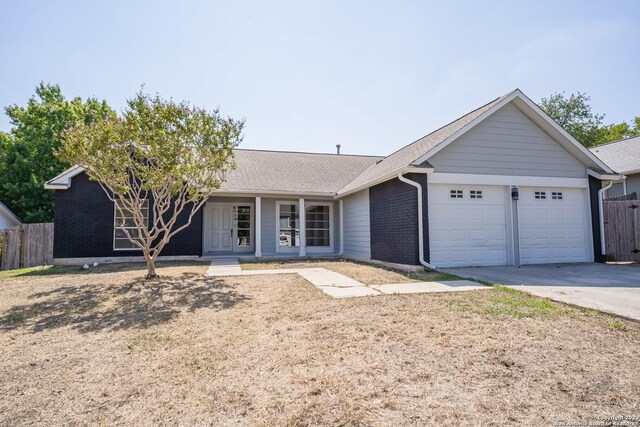 ranch-style house featuring a garage