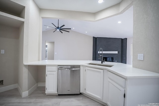 kitchen with sink, white cabinetry, dishwasher, kitchen peninsula, and ceiling fan