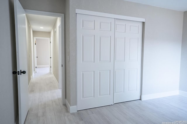 interior space with light hardwood / wood-style flooring and a closet