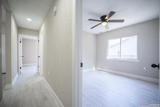 hallway with light wood-type flooring